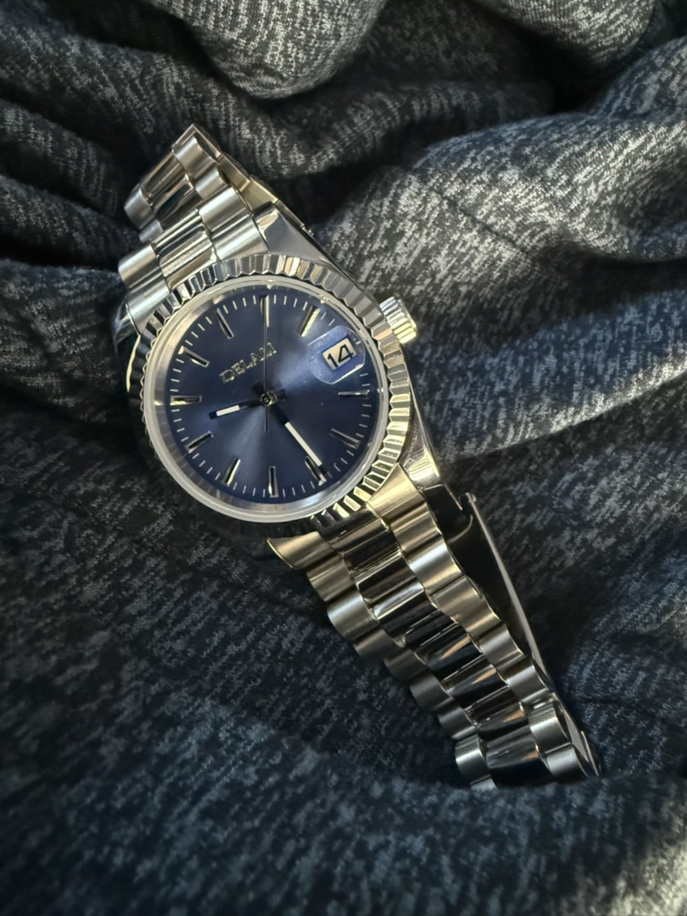 Blue Sunburst Dial Homage — dial close-up on a knit fabric background